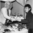 Photo:Gwen Abbott with her son Roy at St. Helier Fair cakestall