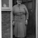 Photo:Mrs. Esther Law  mother of Jack at back door of 220 Wrythe Lane