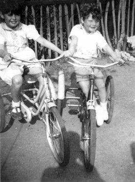 Photo:Tina Goodall "Tiny" and her brother David"Dibby on their bikes in Love Lane Park 1957